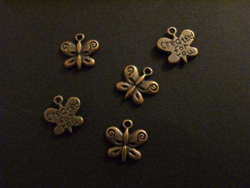 5 copper butterfly charms approx 15mm wide