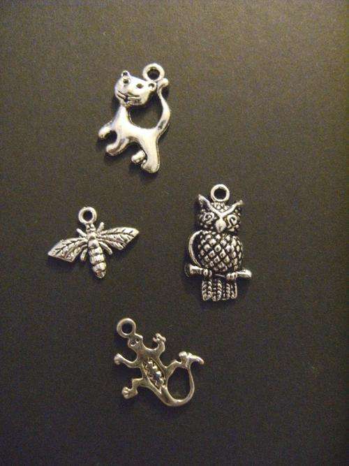 Four mixed animal charms - metal approx 1 - 2 cm diameter