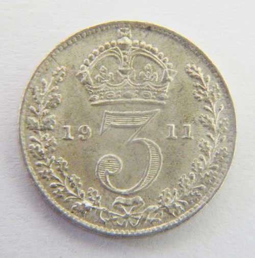 1911 Three pence uncirculated with badly crached marks