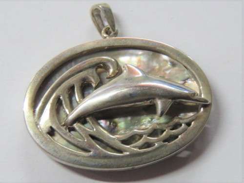 Dolphin and wave pendant in silver with abalone shell by Stuart Benade