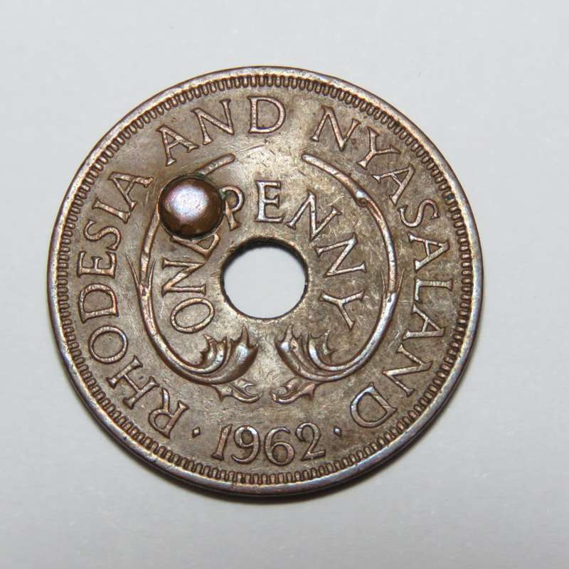1962 Rhodesia and Nyasaland penny with extra punched hole error
