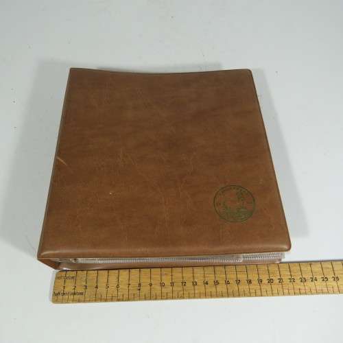 Used coin album with 11 pages