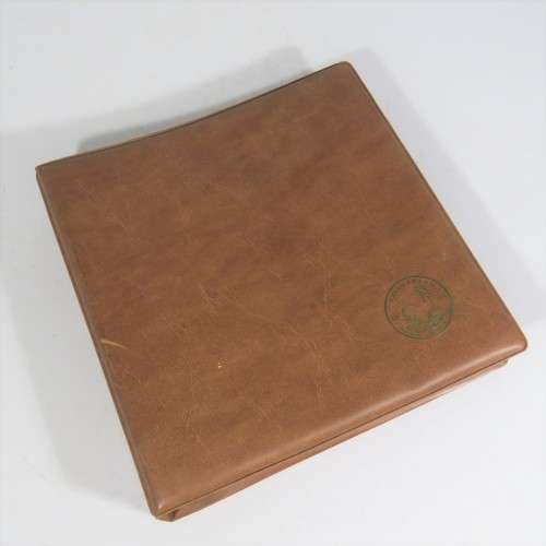 Used coin album with 11 pages