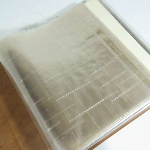 Used coin album with 11 pages