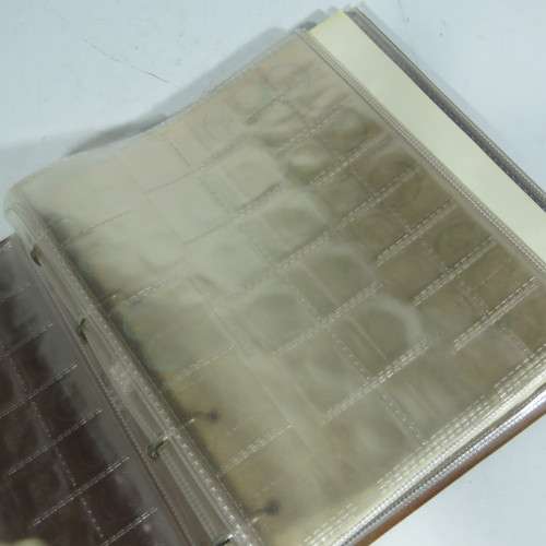 Used coin album with 11 pages