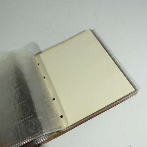 Used coin album with 11 pages