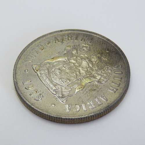 1975 South Africa silver proof one rand with die crack mark over body of Springbok