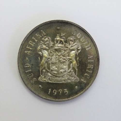 1975 South Africa silver proof one rand with die crack mark over body of Springbok