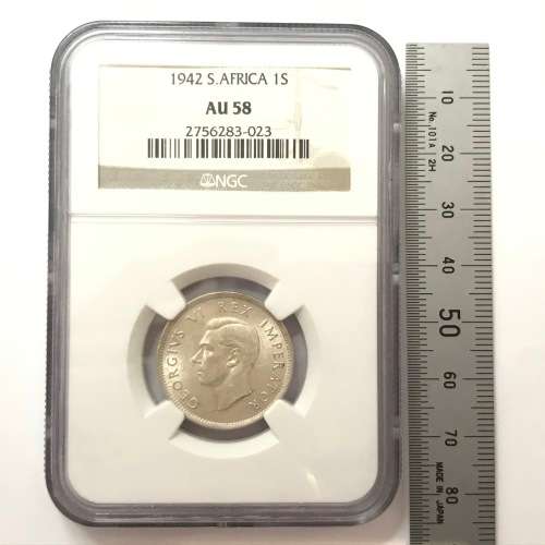 1942 SA Union shilling NGC graded AU 58 - Cracked die through neck variety
