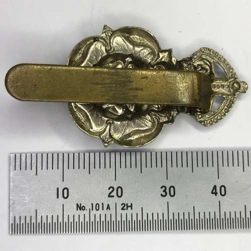 Great Britain The East Lacashire Regiment cap badge - Kings Crown - White metal slide