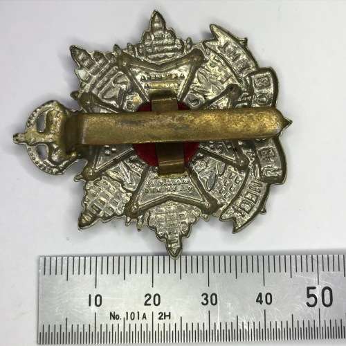 Great Britain The Border Regiment cap badge - K.C - White metal - Slide