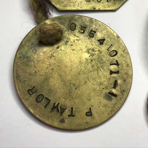 Set of 2 tags marked P Taylor 05541071 - 1