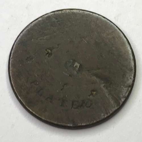 Unknown token - Says `plated` on one side - Also a star and some marks