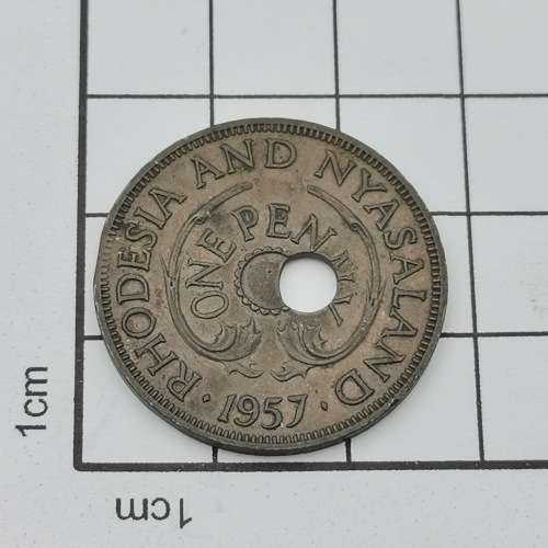 1957 One penny with totally misaligned center hole