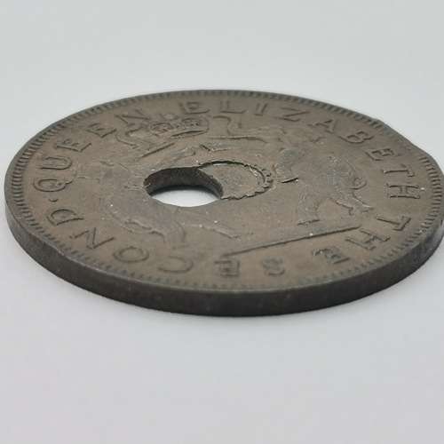 1957 One penny with totally misaligned center hole