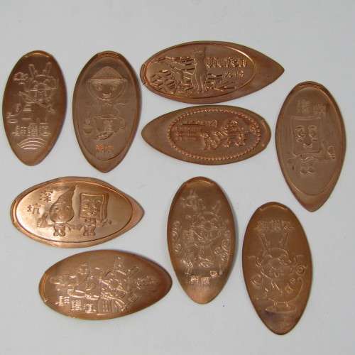 Lot of 9 elongated coins with comic / anime characters
