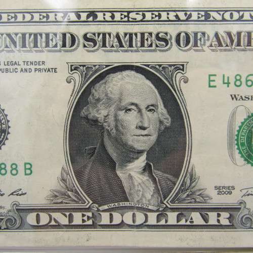 Pair of USA dollar bills with numbers that read the same in reverse