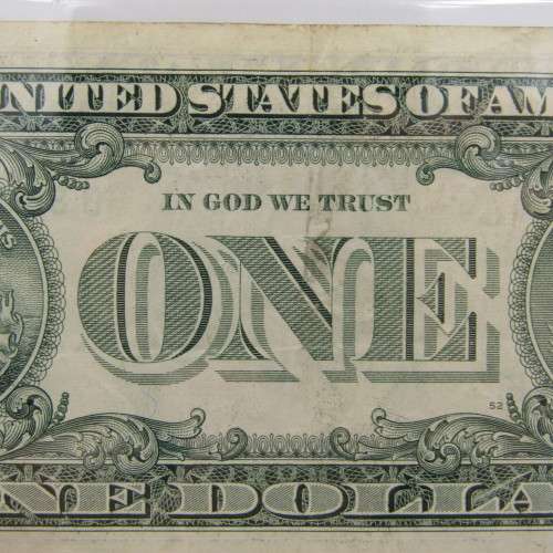 Pair of USA dollar bills with numbers that read the same in reverse