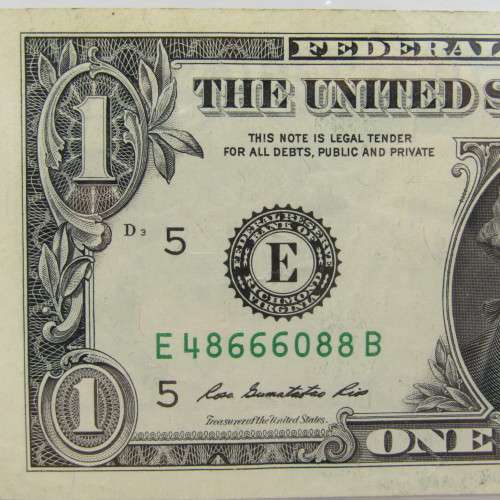 Pair of USA dollar bills with numbers that read the same in reverse