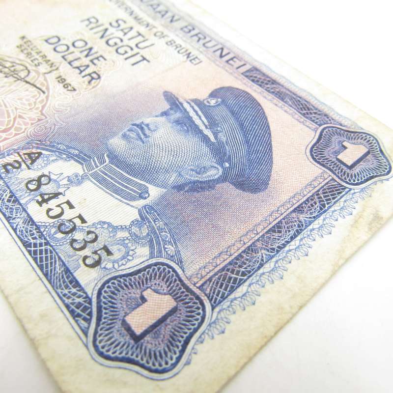 Brunei 1967 One dollar banknote well used