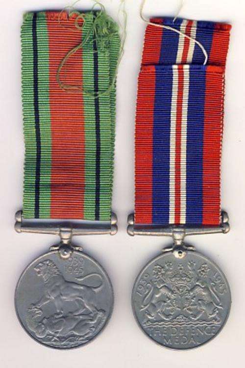 Pair of medals issued to M22455 J. Swartz  - Defence medal and War medal