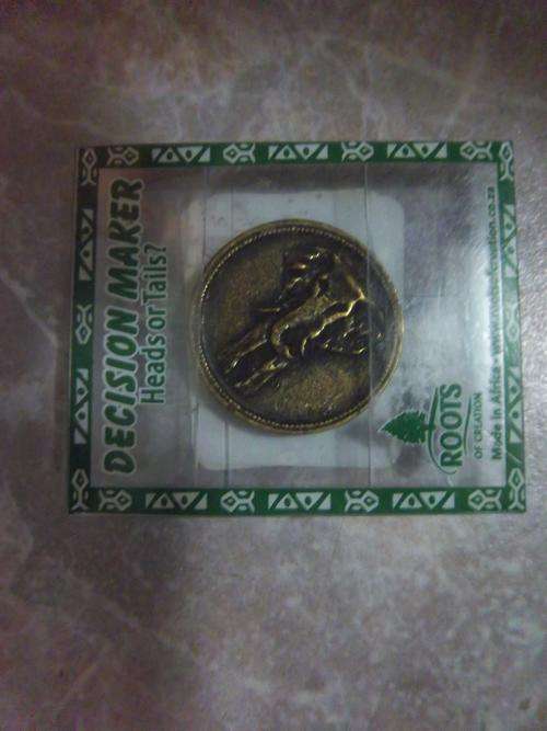 Decision maker coin. Heads or tails.