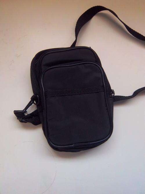 Synthetic carry bag with sling. Two compartments.