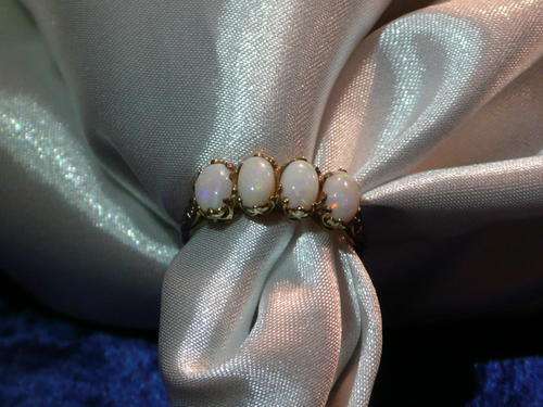 OPALS SET IN 9CT YELLOW GOLD RING