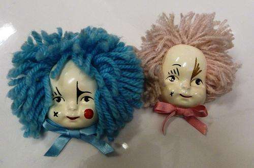 2 small wall mount clown faces