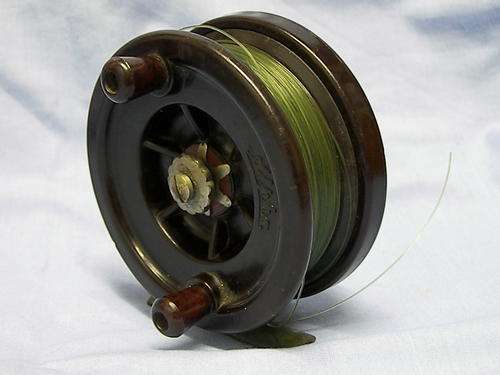 antique bakelite,centre pin fishing reel.