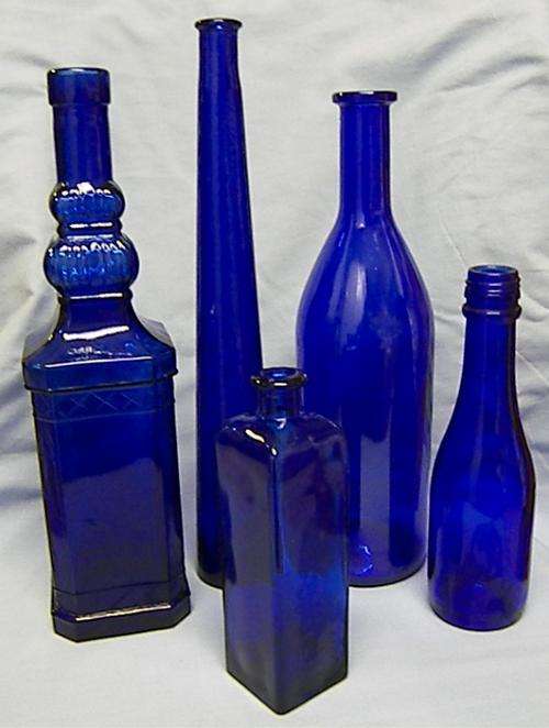 collection of  5 blue bottles