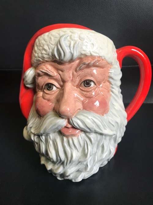 4 ROYAL DOULTON JUGS ( QUEEN VICTORIA , THE INDIAN , SANTA CLAUS , THE LEPRECHAUN )