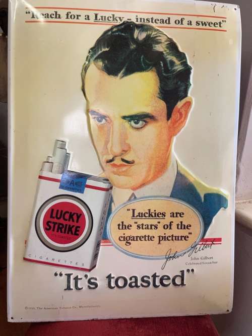 Vintage Lucky Strike Embossed Tin Sign