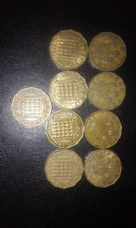9* British Three Pence coins