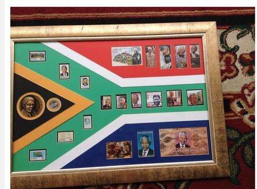 Rare Framed Nelson Madela coin, medal and mounted Nelson mandela stamps.