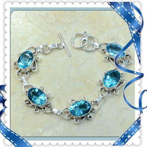 ***INTRICATE SETTING***STUNNING BLUE TOPAZ  GEMSTONE.925 SILVER BRACELET