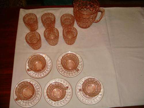 Pink drinking glasses with water jug