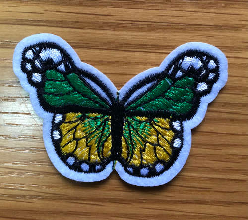 Bufferfly patch in green and yellow on white