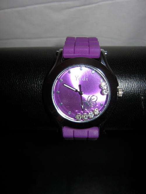 LOVELY PLASTIC WATCH WITH CRYSTALS INSIDE THE DIAL