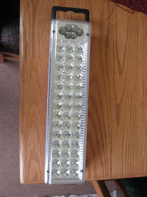 Battery powered LED light with handle