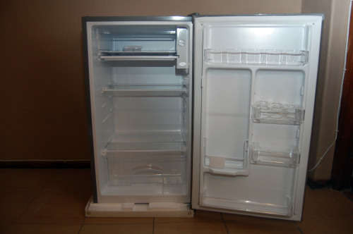 A silver portable Logic Mini bar fridge 120LT available for sale