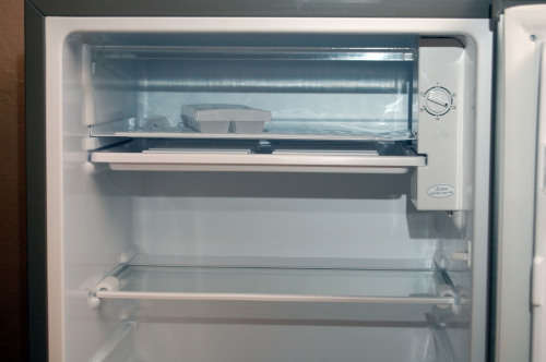 A silver portable Logic Mini bar fridge 120LT available for sale