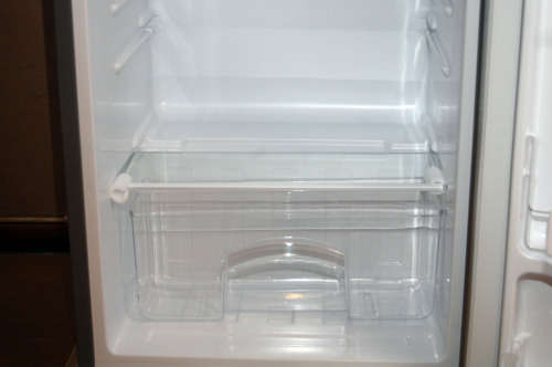 A silver portable Logic Mini bar fridge 120LT available for sale