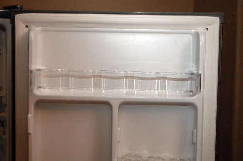 A silver portable Logic Mini bar fridge 120LT available for sale