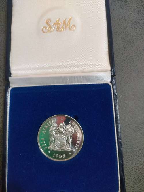 1986 Silver R1 coin in SAM box. Johannesburg