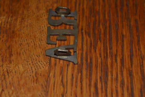 Royal Field Artillery Shoulder title. Lugs Intact.