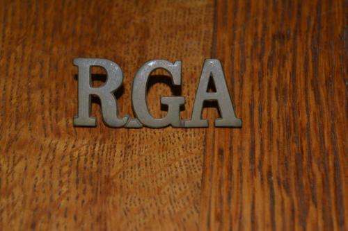 Royal Garrison Artillery Shoulder title. Lugs Intact.