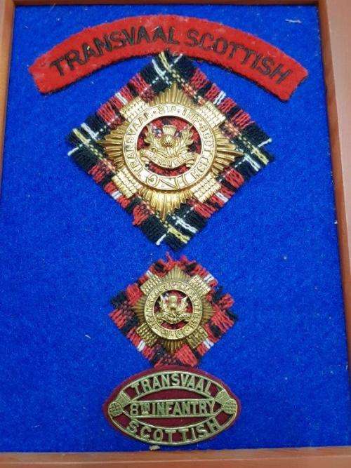 Transvaal Scottish Badges on tartan backings. All lugs intact.