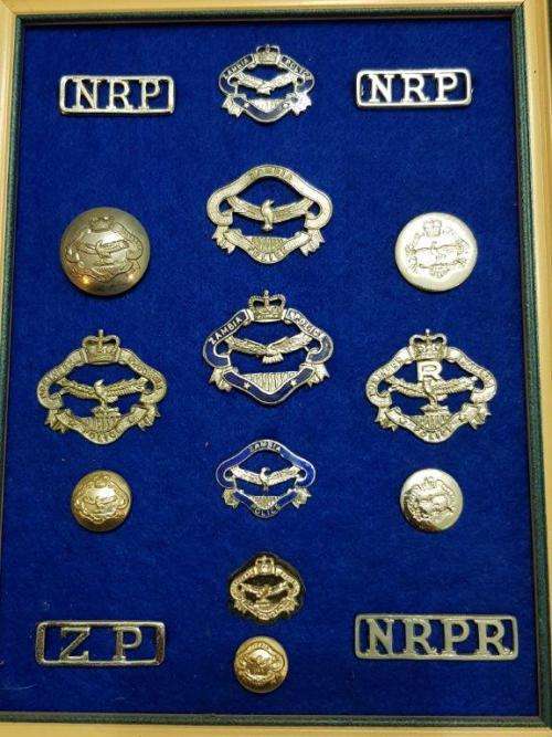 Northern Rhodesia Police and Zambia Police lot badges, titles and collars. Lugs intact.