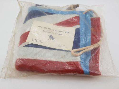 Southern Rhodesia Flag in original packaging. Never used. SRG markings and paper label.